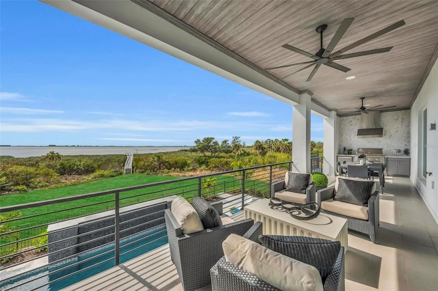 balcony featuring area for grilling, outdoor lounge area, ceiling fan, and a water view