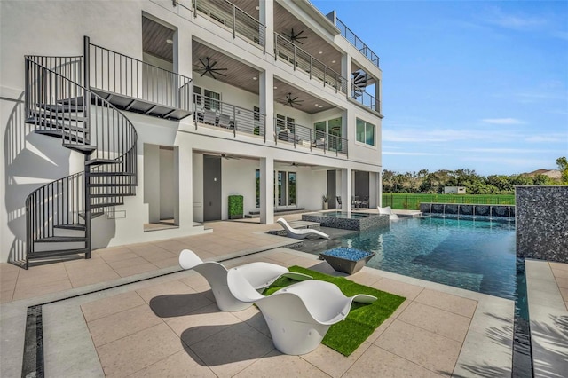 view of swimming pool with a patio area and an in ground hot tub