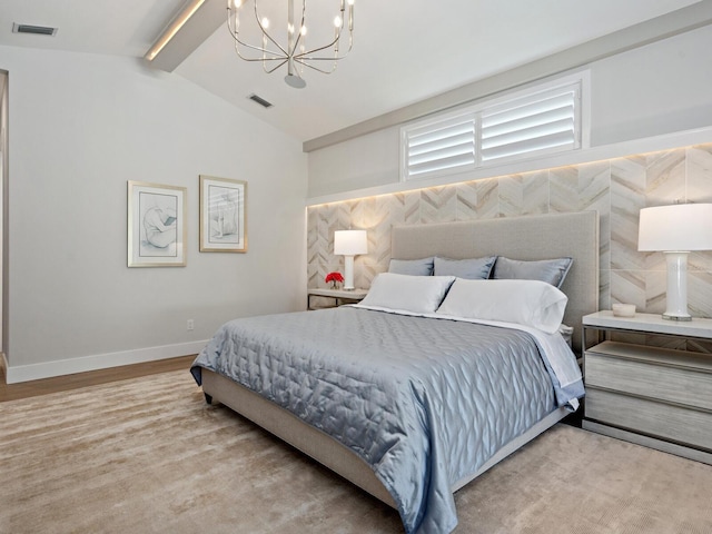 bedroom featuring a chandelier, vaulted ceiling with beams, and light wood-type flooring