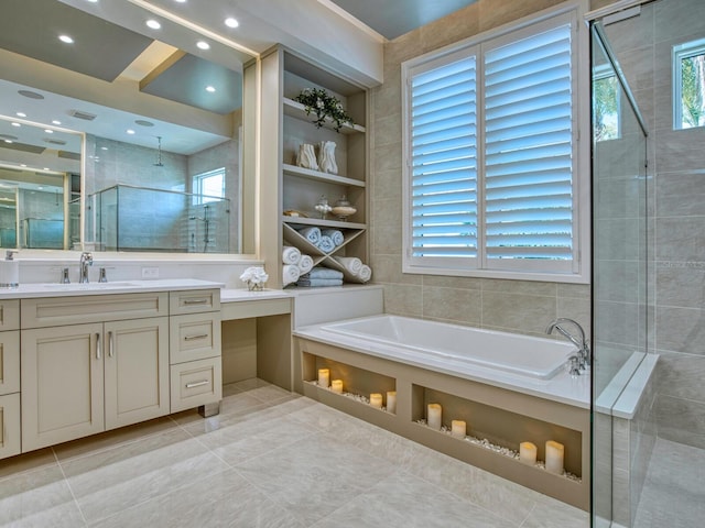 bathroom featuring vanity, tile flooring, and shower with separate bathtub