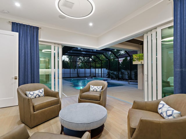 living area featuring floor to ceiling windows and light wood-type flooring