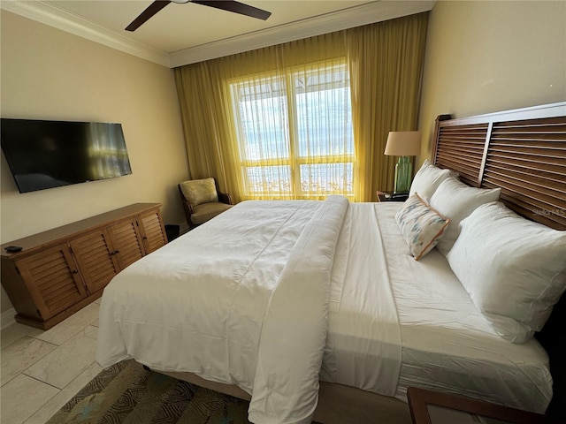 bedroom featuring ornamental molding, ceiling fan, and light tile floors