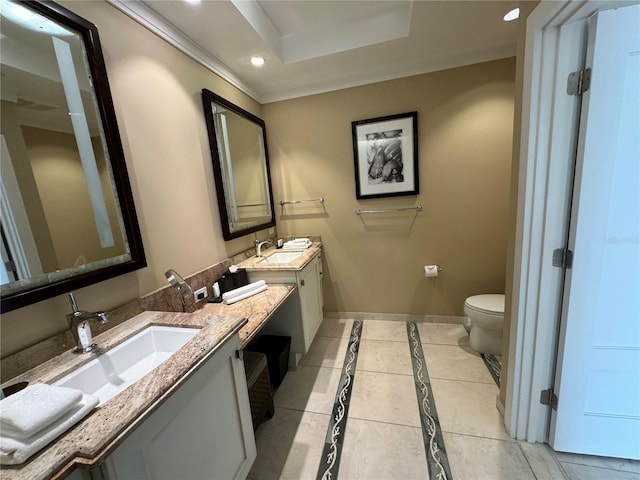 bathroom with tile floors, a raised ceiling, toilet, and dual bowl vanity