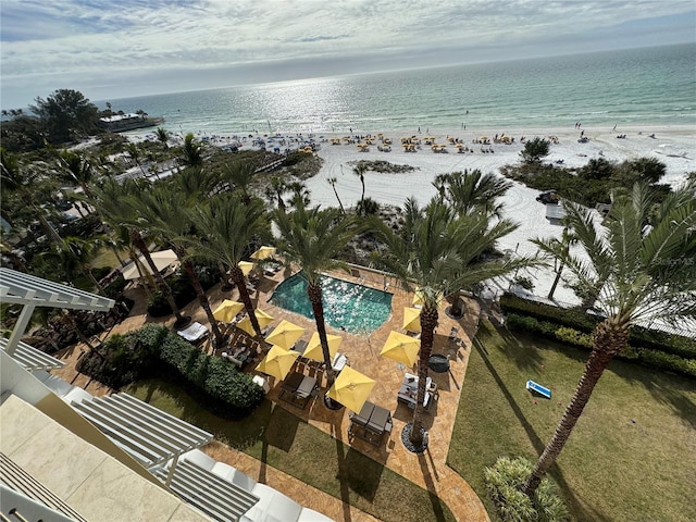 birds eye view of property featuring a water view and a view of the beach