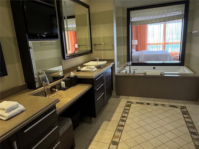 bathroom featuring tile flooring, a bathing tub, and vanity