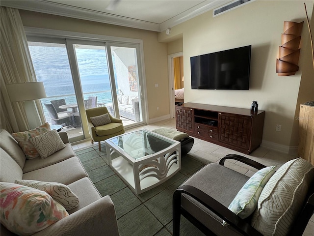 living room featuring a water view, tile flooring, and ornamental molding