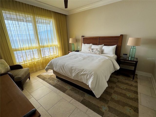 bedroom with crown molding, light tile flooring, and ceiling fan