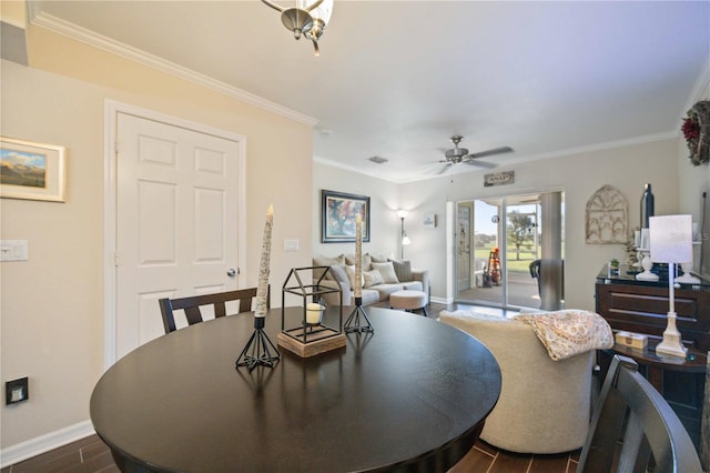 dining room with ornamental molding, ceiling fan, and dark wood-type flooring