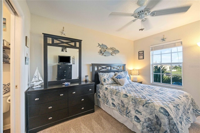 carpeted bedroom with ceiling fan