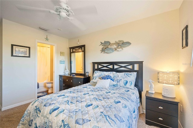 carpeted bedroom with ceiling fan and ensuite bath