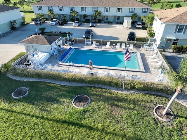 view of swimming pool featuring a lawn and a patio