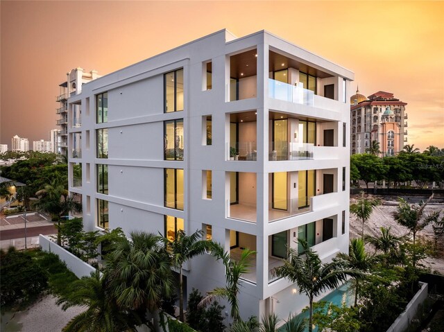 view of outdoor building at dusk