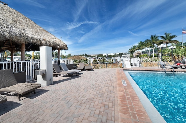 view of swimming pool featuring a patio area