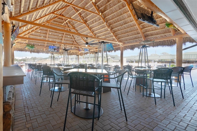 view of patio featuring a gazebo, an outdoor bar, and ceiling fan