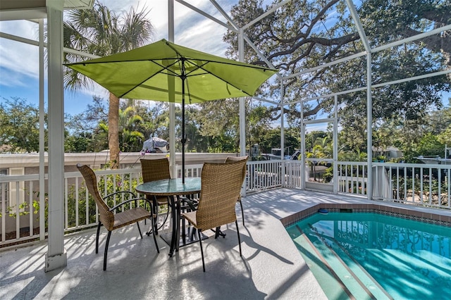 exterior space with a patio and glass enclosure