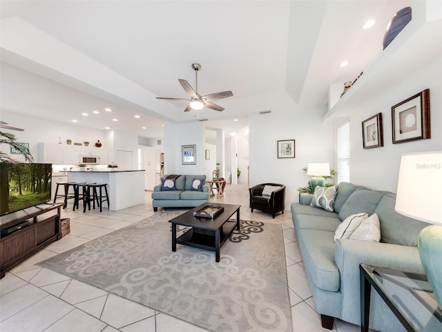 tiled living room with ceiling fan