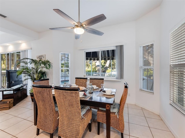 dining space with light tile floors, ceiling fan, and a healthy amount of sunlight