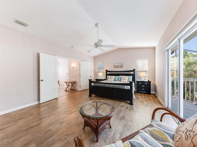 living room with vaulted ceiling, ceiling fan, and light hardwood / wood-style flooring