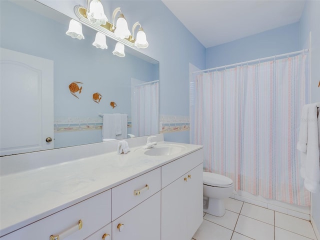 bathroom featuring toilet, large vanity, and tile flooring