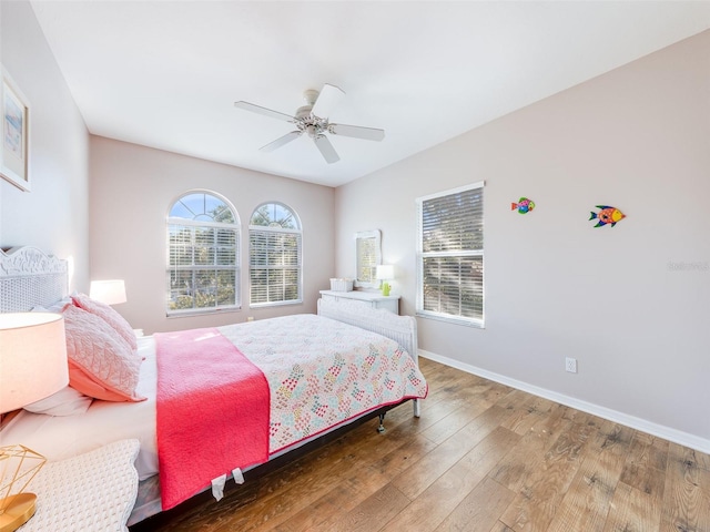 bedroom featuring ceiling fan and dark wood-type flooring