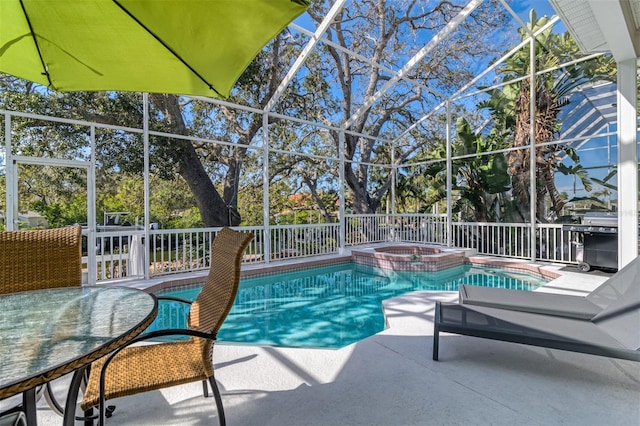 view of pool featuring grilling area, an in ground hot tub, a patio, and a lanai