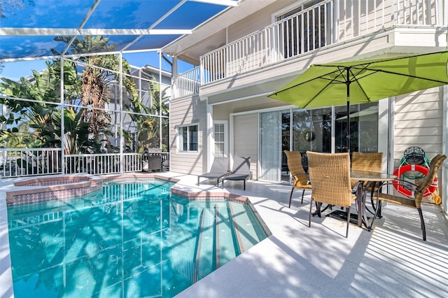 view of pool featuring a patio area and a lanai