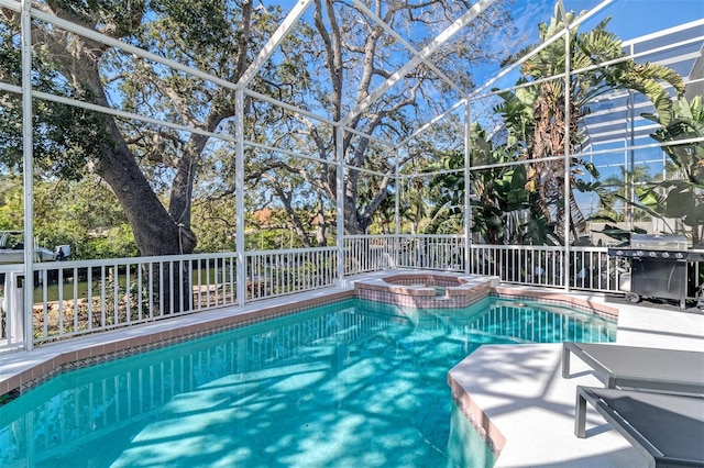 view of swimming pool with an in ground hot tub and a lanai