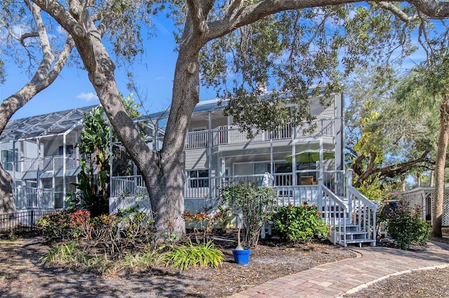 view of front of property featuring a balcony