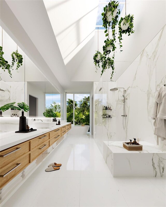 bathroom featuring vaulted ceiling, tile flooring, separate shower and tub, and vanity