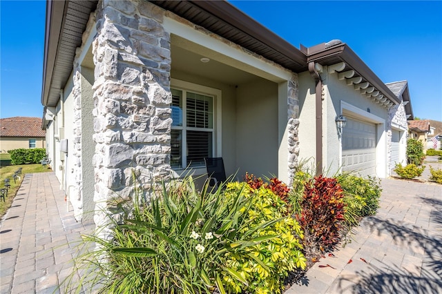 view of side of home featuring a garage