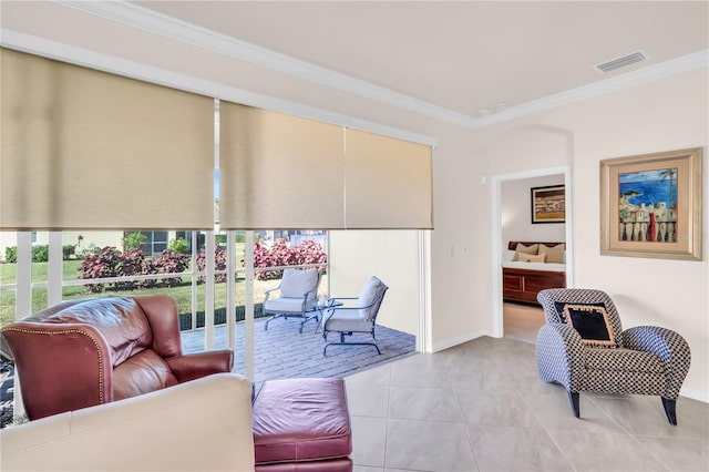 living room featuring light tile patterned floors and ornamental molding