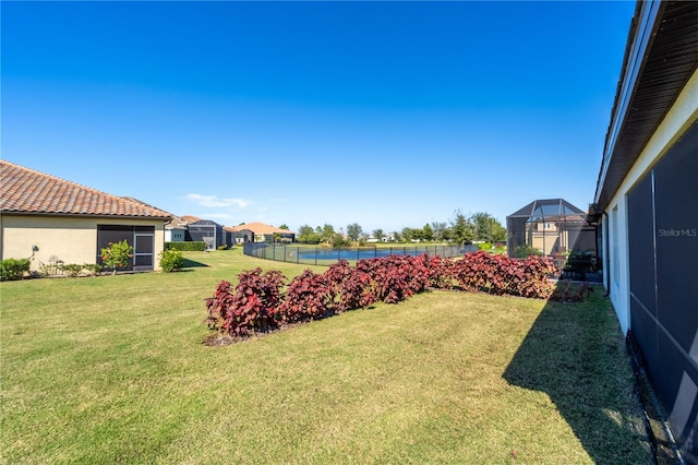 view of yard with a lanai