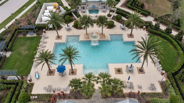 view of swimming pool with a patio area