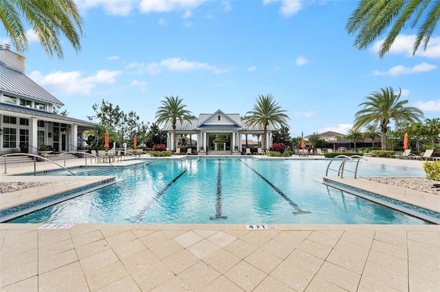 view of swimming pool featuring a patio area