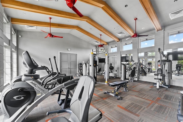 gym featuring dark colored carpet and high vaulted ceiling