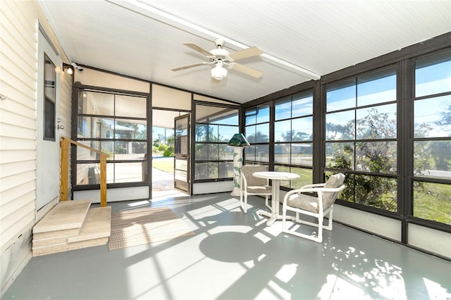 sunroom featuring ceiling fan