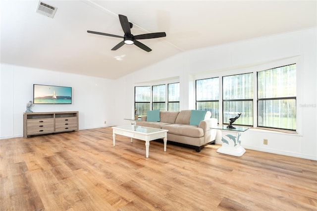 living room with ceiling fan, vaulted ceiling, light hardwood / wood-style flooring, and a wealth of natural light