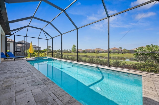 view of pool featuring a patio area and glass enclosure