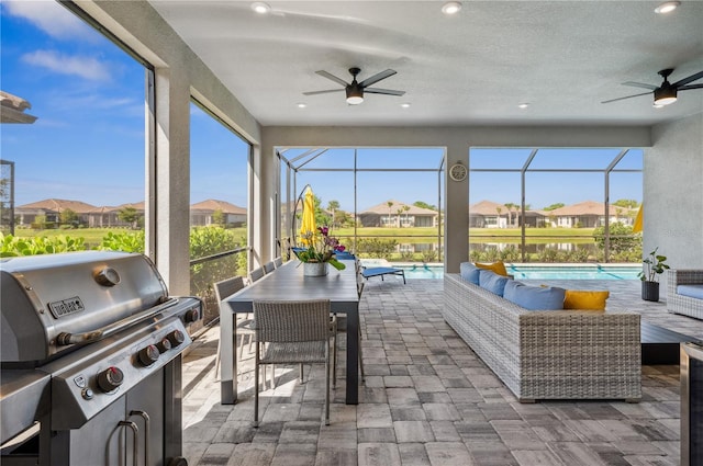 sunroom / solarium with ceiling fan