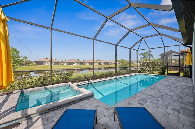 view of pool with a water view, a patio area, an in ground hot tub, and a lanai