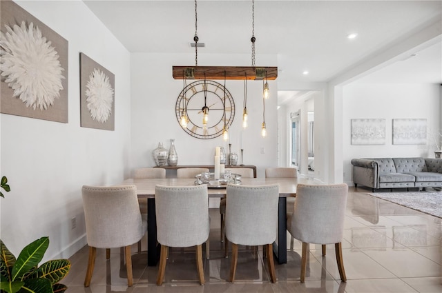 dining area featuring baseboards, tile patterned flooring, and recessed lighting