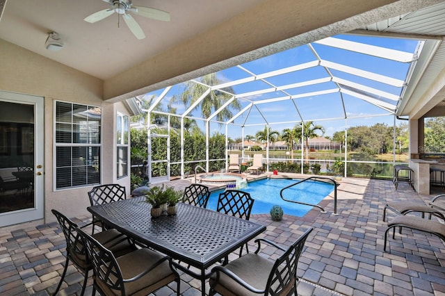 view of swimming pool featuring an in ground hot tub, glass enclosure, and a patio