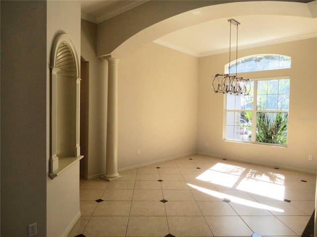 unfurnished dining area with light tile patterned floors, ornamental molding, a chandelier, and ornate columns