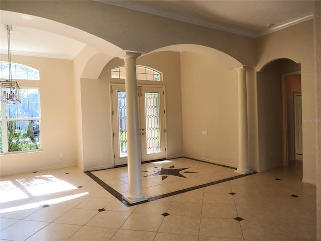 tiled entryway featuring ornate columns and ornamental molding