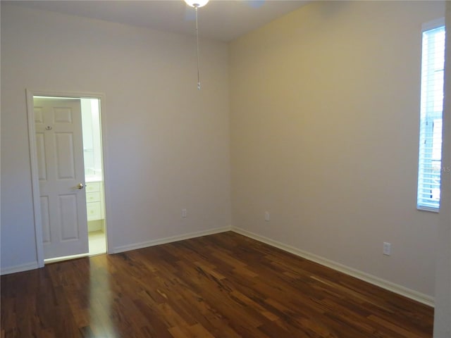 unfurnished room featuring dark hardwood / wood-style flooring