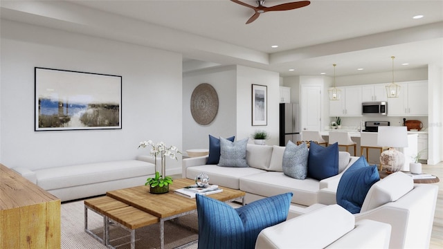 living room with light hardwood / wood-style floors and ceiling fan