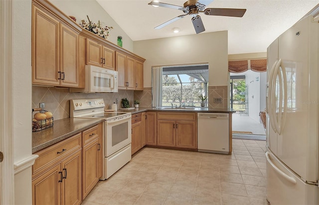 kitchen featuring sink, light tile patterned flooring, decorative backsplash, lofted ceiling, and white appliances