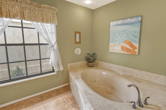 bathroom with tile patterned flooring and a relaxing tiled tub