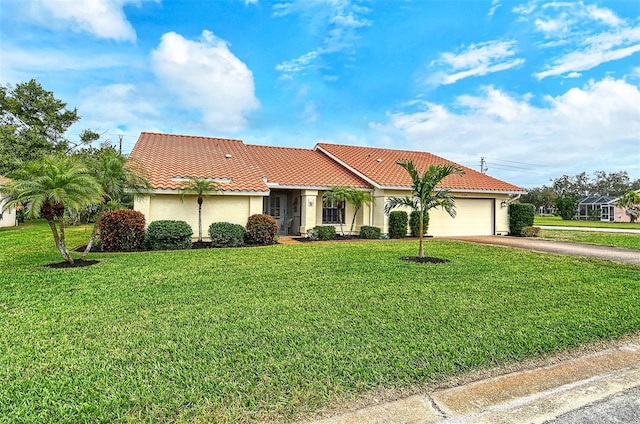 mediterranean / spanish house with a front yard and a garage