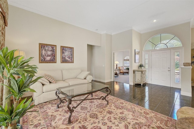 living room featuring dark tile flooring and ornamental molding